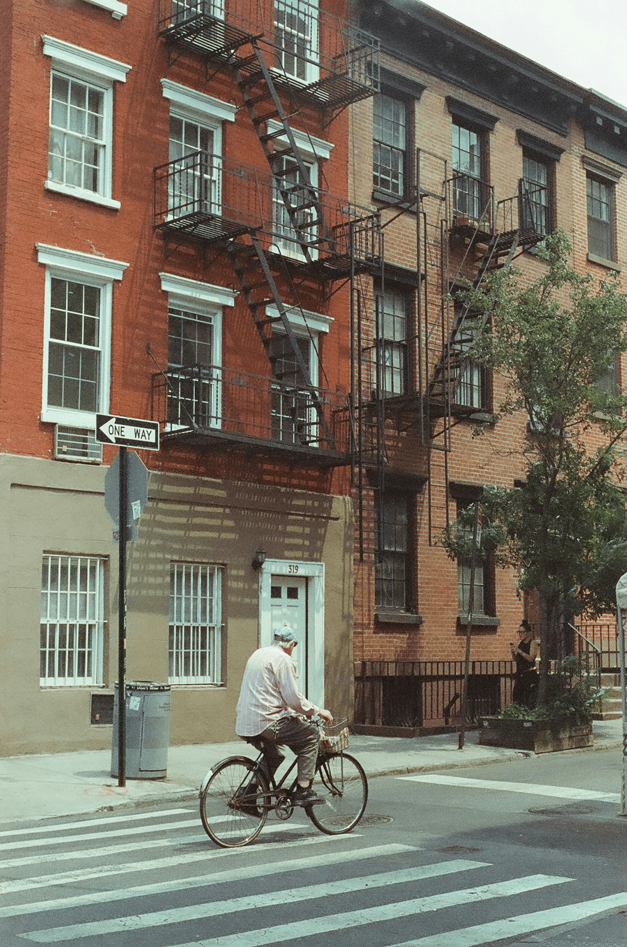 Older man cycling on a New York City street